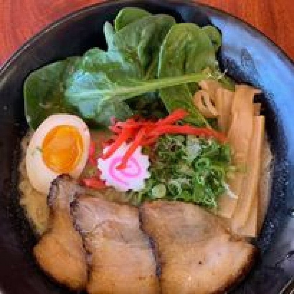 Tonkotsu ramen bowl with chashu pork, soft egg, and greens at Akami Poke and Noodle Bar in Durango