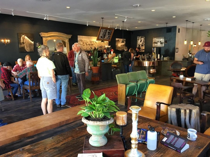 Interior of Durango Coffee Company on Main Ave with vintage horse portraits