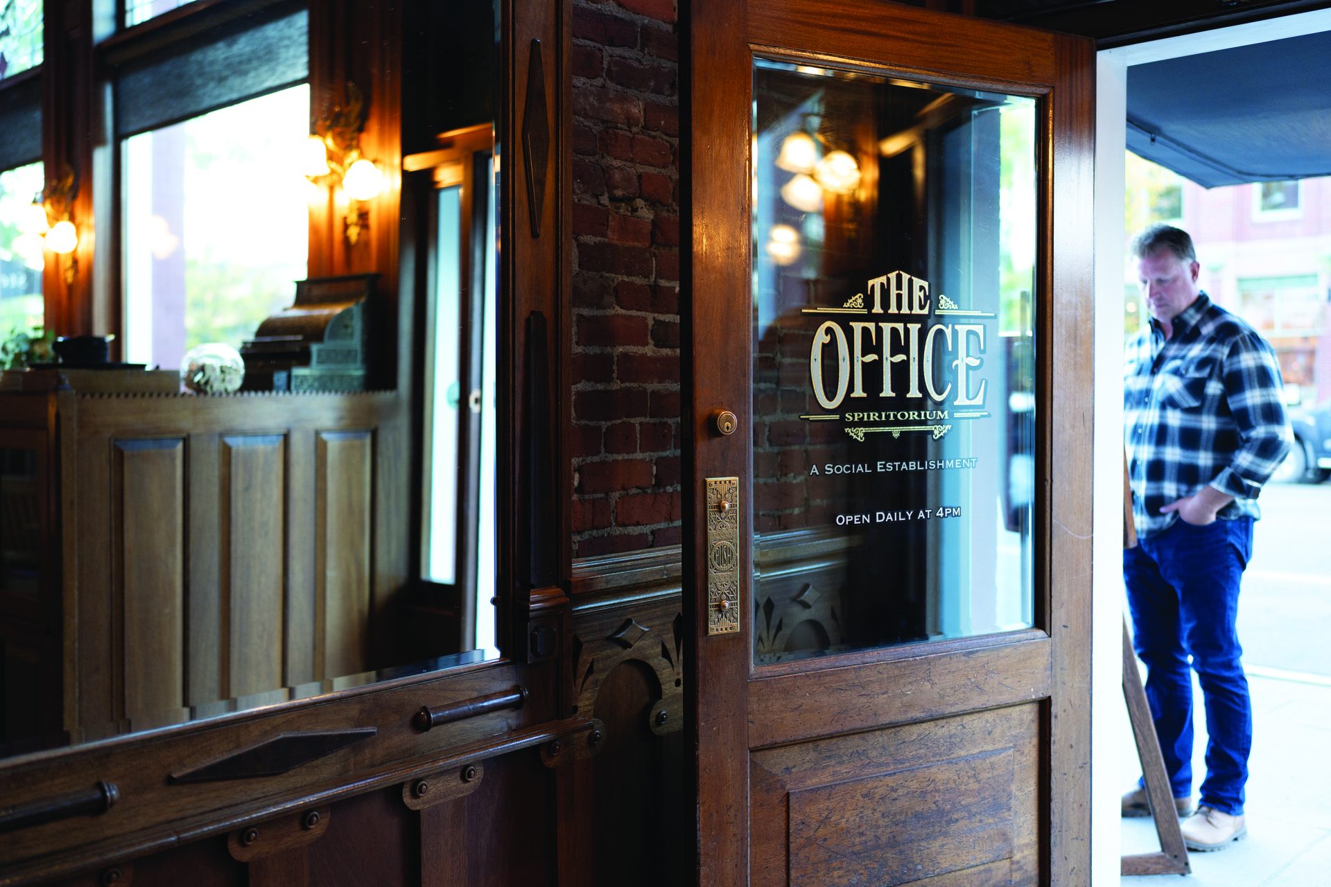 Victorian bar interior at The Office Spiritorium inside the Strater Hotel